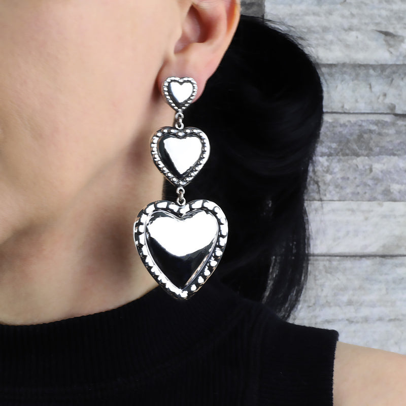long oversized Mexican silver triple heart statement earrings