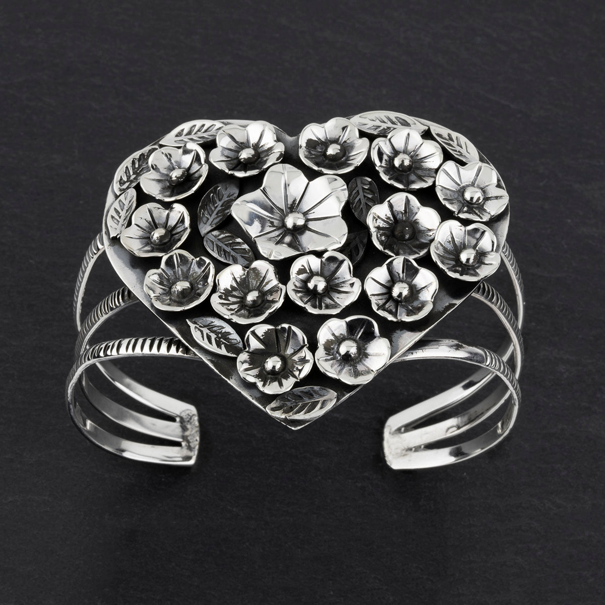 Taxco silver heart shaped floral cuff bracelet