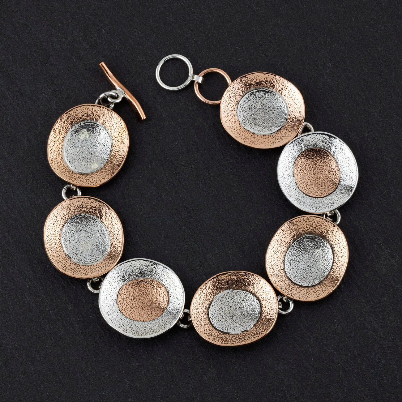 artisan silver and copper circle link bracelet