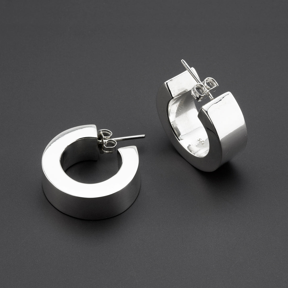 bold curve thick silver hoop earrings