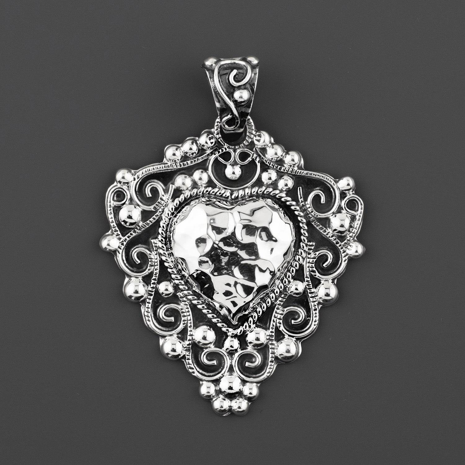 corazon bravo Taxco silver pendant