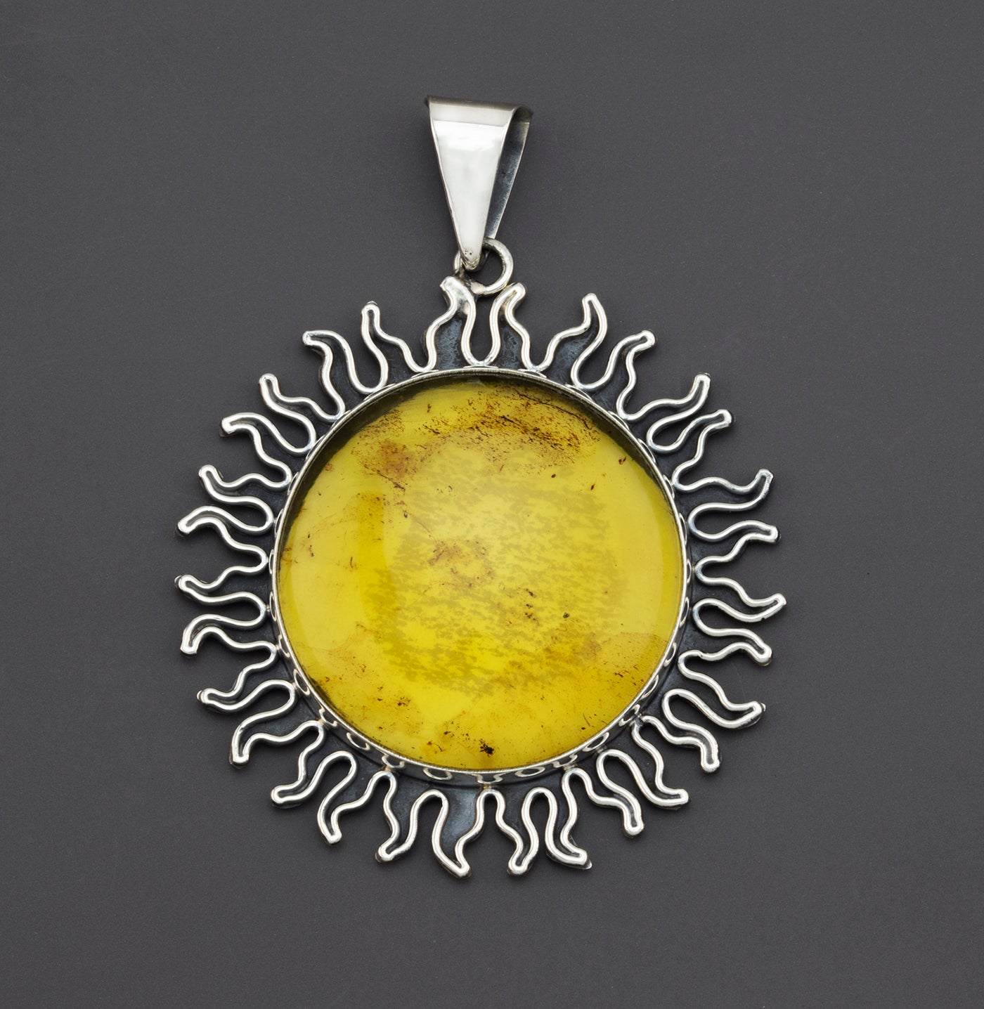 large amber sun pendant