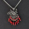 peacock Mexican silver and coral pendant