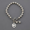 pearl sacred heart charm bracelet