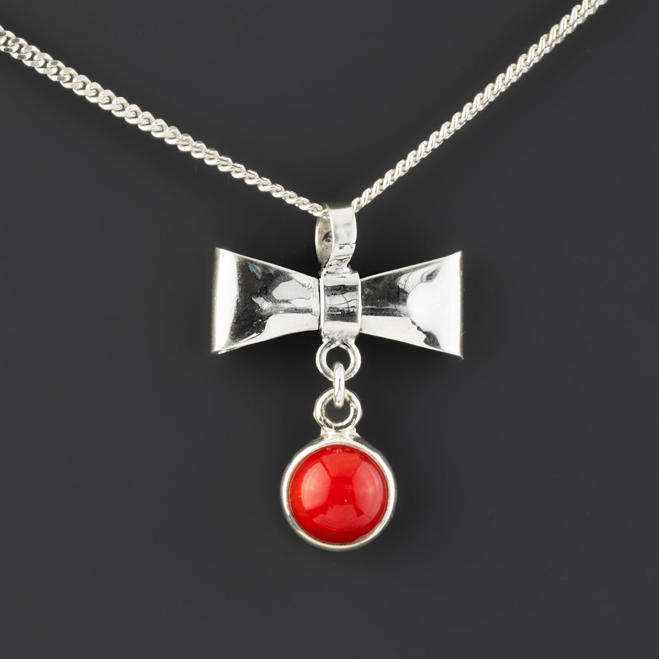 red coral sterling silver bow pendant