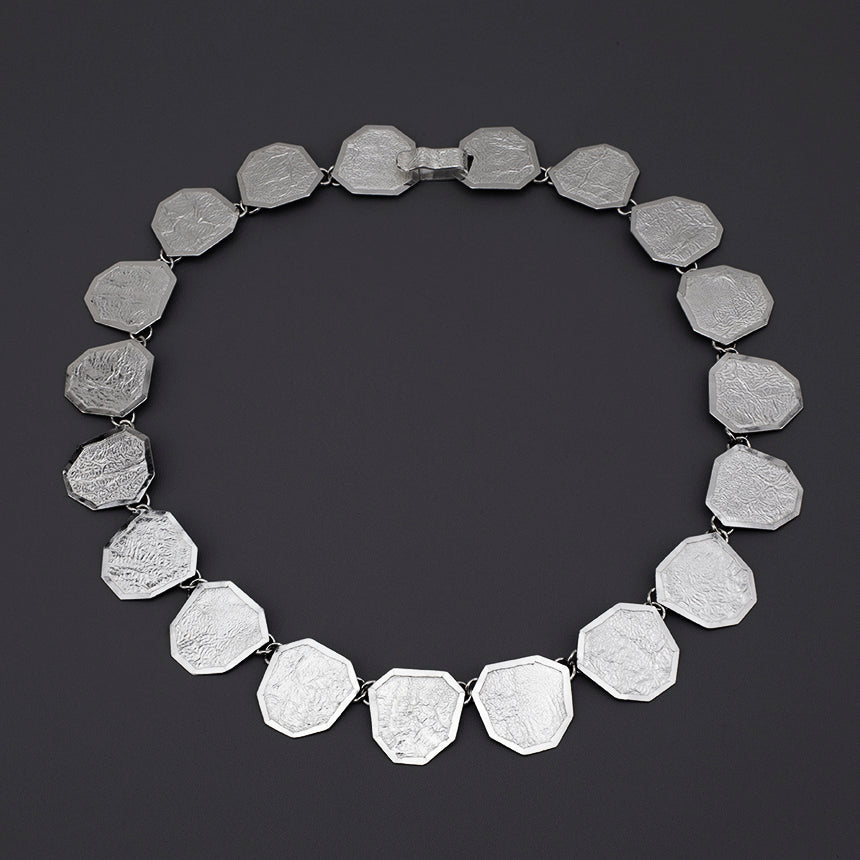 reticulated silver statement necklace