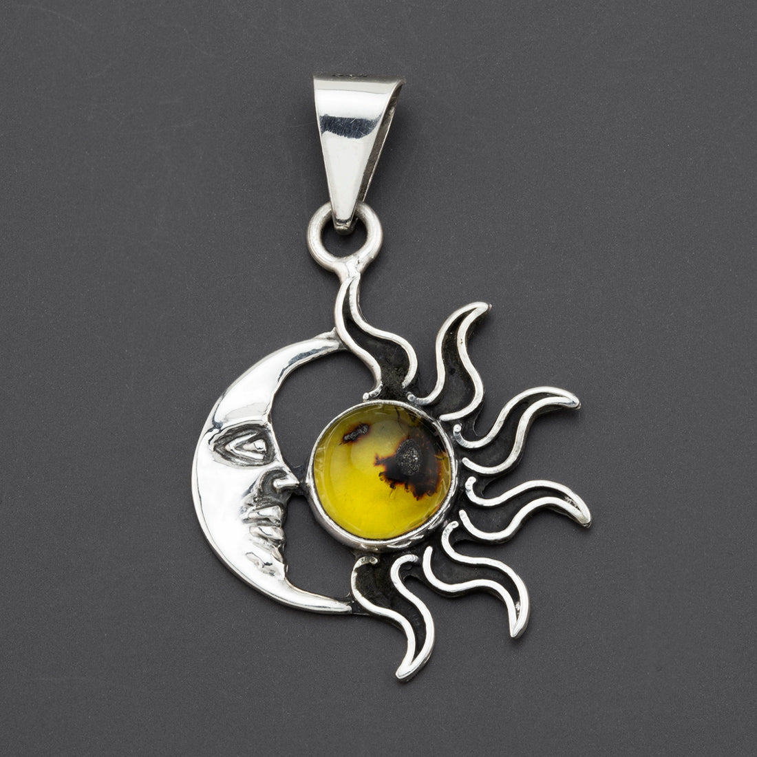 solar eclipse amber pendant
