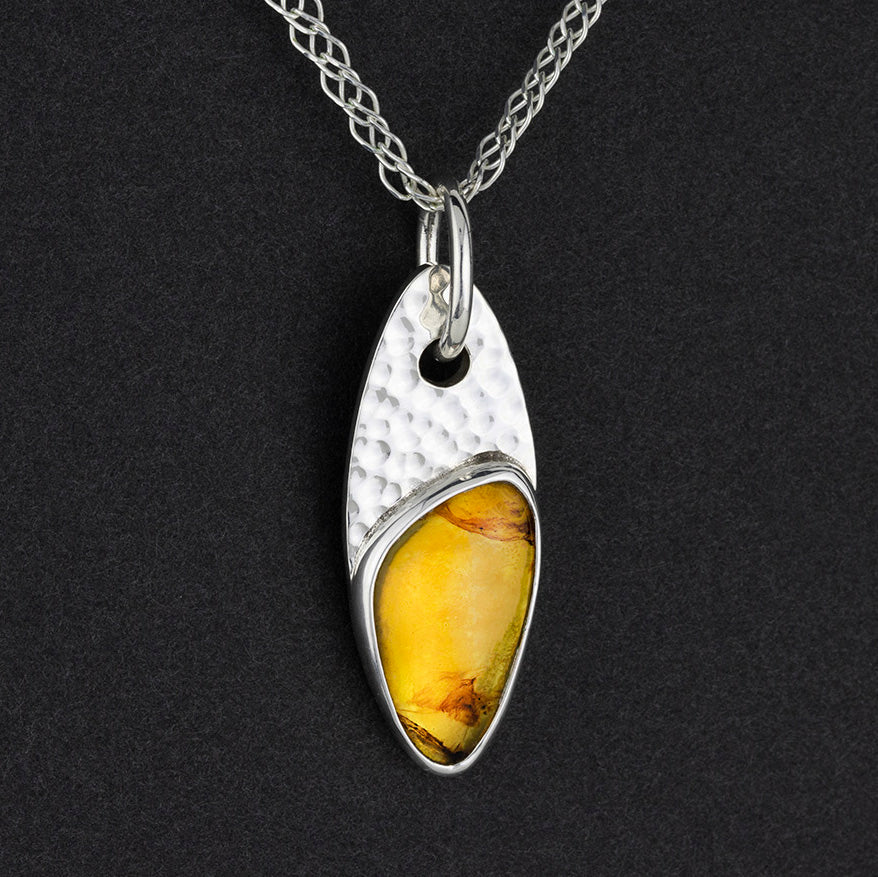 sun dancer sterling silver amber pendant