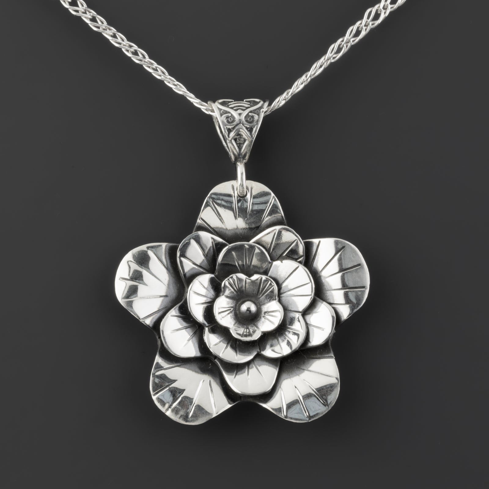 Taxco sterling silver floral pendant